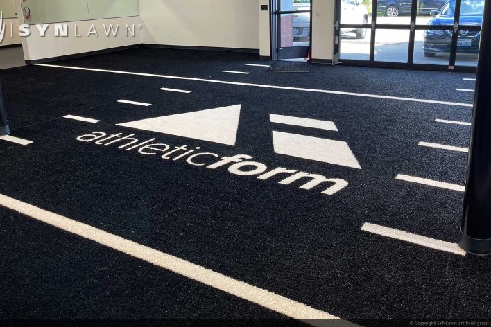 image of SYNLawn Billings MT prefab turf logos for athletic weight room applications